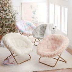 a living room filled with furniture and a christmas tree