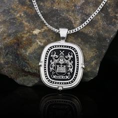 Family Crest Necklace, Personalized Family Crest Necklace, Custom Coat of Arms Necklace, Family Jewelry, Custom-made Engraved Necklace Product Details: ✅Material: 925 Sterling Silver, Gold Coating ✅Letter Design: Choose your desired letter for customization ✅Handmade with exceptional craftsmanship ✋🎨 ✅ Dimensions: 20mm  ✅ Weight: ±6gr 🛡️ Discover our custom coat of arms jewelry, a symbol of heritage made uniquely yours! 🌟💍 Choose your family crest and let us bring it to life with expert craftsmanship. 🖌️✨ Our artisans create stunning pieces in silver, gold coating, or rhodium coating, tailored to your preferences. 💫🔒 With attention to detail and a touch of elegance, our jewelry collection includes signet rings, pendants, and bracelets, each designed to showcase your personalized coa Luxury Oval Pendant Necklace For Collectors, Black Sterling Silver Jewelry With Engraving Option, Luxury Engraved Custom Necklace For Formal Occasions, Luxury Engraved Formal Custom Necklace, Luxury Sterling Silver Pendant Necklace, Handmade Luxury Custom Necklace, Luxury Custom Sterling Silver Necklace As Gift, Luxury Collectible Jewelry With Engraving Option, Luxury Necklace With Sterling Silver Clasp For Gift