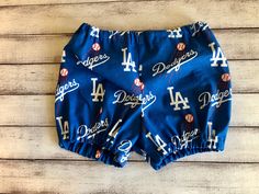 This item is not affiliated with the Los Angeles Dodgers baseball Team. Made from 100% quality cotton. BUMMIES SIZES: 0-3 Months 3-6 Months 6-12 Months 12-18 Months 18-24 Months 2T 3T Please allow for slight variations in fabric placement, etc. as each item is handmade to order. Boy Girl Twins, Dodgers Baseball, Baby Bloomers, Diaper Cover, Los Angeles Dodgers, Baby Headbands, Newborn Photos, Baby Boy Outfits, Boy's Clothing