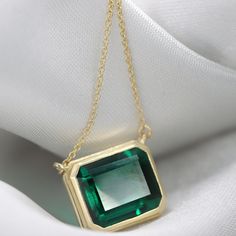 "Handmade by an inspired jewelry artist team with decades of experience in the craft of jewelry making. Each gemstone, each diamond is carefully picked. Using only the finest raw materials and the highest industry standard in manufacturing, design and finish. Set with an Emerald chatham octagon cut 12x10 6.52ct Inside a 14K gold frame A perfect vintage inspired piece to make a statement and steel the show √ Made in Solid 14K Gold, in your choice of color: Rose Gold, Yellow Gold, White Gold with Rectangular Emerald Necklace For May Birthstone, Rectangular Emerald Necklace Fine Jewelry, Rectangular Emerald Fine Jewelry Necklace, Rectangular Emerald Gemstone Necklace, Classic 14k Gold Emerald Cut Emerald Necklace, Formal 14k Gold Emerald Birthstone Necklace, Formal Emerald Rectangular Pendant Jewelry, Rectangular Emerald Necklace In Fine Jewelry Style, Rectangular Emerald Jewelry With Bezel Setting