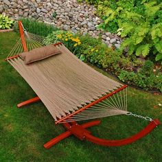 a hammock is sitting in the grass