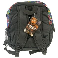 a back pack with a tag attached to it's front pocket and an image of a monster on the side