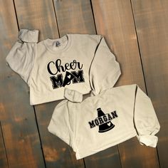 Custom Glitter or Non-Glitter Cheer Mom Sweatshirt Show your spirit with our Sparkling Cheer Mom Sweater, designed to make you shine brighter than the cheer squad :) ! *This custom shirt is handmade with professional vinyl. *Our shirts are unisex and are true to size! *In the photo's you will be able to see the custom options in regards to color that you may choose from. *We use 100% cotton shirts. The glitter material does not wash off and will last through multiple washes.  *If your shirt color is out of stock we will contact you as soon as possible to see if you would like to change shirt colors. By purchasing from us you agree to the following statements: *Due to the custom nature of this item we do not accept exchanges or refunds. *We are also not responsible for lost packages. Please Casual Glitter Print Tops For Cheerleading, Long Sleeve Cotton Tops With Glitter Print, Team Spirit Crew Neck Top With Glitter Print, Glitter Print Crew Neck Tops For Fall, Crew Neck Top With Glitter Print For Fall, Cotton Cheerleading Top With Glitter Print, Cotton Tops With Glitter Print For School Spirit, Cheerleading Fan Apparel Tops For Fall, Fall Cheerleading Top With Letter Print