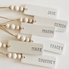 three tags with names on them are attached to string