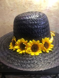 Beautiful lightweight mahogany straw hat with sunflowers and tied raffia band in contrasting shades of sunny yellow and orange. Fits head circumferences from 21 inches to 23 inches. Great hat for any occasion and because the hues are so easy on the eye you're sure to wear it for years to come. Adjustable Sun Hat With Flower Design For Vacation, Adjustable Flower Hats For Vacation, Adjustable Summer Sun Hat With Flower Design, Adjustable Summer Sun Hat With Flower Shape, Adjustable Flower Sun Hat For The Beach, Adjustable Summer Flower Sun Hat, Adjustable Flower-shaped Sun Hat For Vacation, Straw Sun Hat For Festival, Straw Sun Hat For Festivals