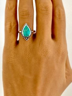 A Vintage Style bohemian genuine turquoise ring set in sterling silver plated with rhodium. Ring in approx. .75" tall x .5" wide. Stone size is 13 x 9 mm. Band width is approx. 2.2mm Bohemian Sterling Silver Turquoise Wedding Ring, Bohemian Teardrop Turquoise Ring In Silver, Bohemian Silver Turquoise Teardrop Ring, Bohemian Silver Teardrop Turquoise Ring, Bohemian Teardrop Turquoise Ring, Bohemian Style Emerald-colored Ring, Bohemian Sterling Silver Turquoise Teardrop Ring, Bohemian Sterling Silver Turquoise Ring With Eco-friendly Gemstones, Bohemian Turquoise Gemstone Ring For Anniversary