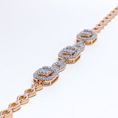 This stunning 18k gold halo bracelet, weighing 10.0 grams, features a sophisticated design adorned with 1.02 carats of diamonds. The diamonds, in round brilliant cut and baguette shapes, have a color grade of F-G and a quality grade of VS, adding exceptional sparkle and elegance. The rose gold finish enhances its luxurious appeal, making it perfect for any special occasion. The bracelet has a size of 7.5 inches, offering both style and comfort. This piece is openable, designed with a push snap l Diamond White Bracelets With Baguette Diamonds, Rose Gold Diamond Bracelets With Baguette Diamonds, Wedding Rose Gold Diamond Bracelet With Baguette Diamonds, Elegant Wedding Bracelets With Halo Setting, Cubic Zirconia Diamond Bracelet With Halo Setting, Classic Diamond Bracelet With Halo Setting In Cubic Zirconia, Classic Diamond Bracelet With Halo Setting And Cubic Zirconia, Elegant Diamond Tennis Bracelet With Halo Setting, Diamond Tennis Bracelet With Halo Setting For Formal Occasions