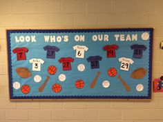 a bulletin board with sports themed items on it