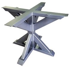 a metal table that is sitting on a white surface