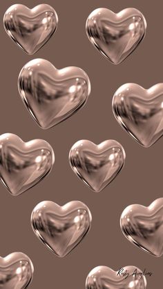 many shiny hearts on a brown background