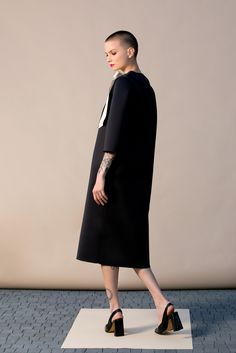 "With this beautiful Minimalist Dress we introduce our fashion for Spring 2019 ! This stylish black dress is cut in the the brand's most recognizable silhouette - the laid-back approach to elegance. The design has straight, elegant silhouette - it is our go-to for effortless, easy-to-wear pieces. Wear your occasion dress with sandals, high heels, ballerinas. ITEM DETAILS: - straight line - side pockets - shoulder bow decorations - custom orders: yes - color: black and creamy COMPOSITION AND CARE Black A-line Dress For Office Wear, Structured Midi Dress For Party, Modern Knee-length Party Dress, Structured Knee-length Evening Midi Dress, Structured Knee-length Midi Dress For Cocktail, Structured Knee-length Midi Dress For Evening, Black Knee-length Dress For Office, Chic Black Workwear Dress, Chic Black Midi Dress For Work