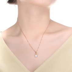 Add a stunning luster to your look with this pearl solitaire pendant necklace that features a white round shell pearl solitaire pendant with a subtle accent of clear round cubic zirconia to complement the pearl. This necklace is crafted in .925 Sterling silver with gold plating and secures with a spring ring clasp. The basic yet gorgeous design of this necklace will look great with any ensemble. Only if necessary, use a suede cloth and delicately clean the surface of the jewel Item Should not co Rose Gold Pearl Chain Necklace, Rose Gold Round Necklace With Pearl Pendant, Elegant Teardrop Pendant Necklace With Single Diamond, Rose Gold Jewelry With Pearl Pendant, Elegant Pearl White Teardrop Pendant Jewelry, Elegant Teardrop Pendant Solitaire Necklace, Rose Gold Necklaces With Pearl Charm, Elegant Solitaire Necklace With Teardrop Pendant, Rose Gold Round Necklaces With Pearl Charm