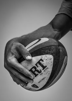 a person holding a basketball in their hand