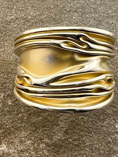 Beautiful silver and gold ring , I have a bangle to match this in my listings. Gift Yellow Gold Wide Band Bangle, Yellow Gold Wide Band Bangle As Gift, Gold Polished Sterling Silver Bangle, Gold Sterling Silver Cuff Bracelet With Polished Finish, Gold Ring-shaped Bracelet For Anniversary, Unique Gold Sterling Silver Cuff Bracelet, Unique Formal Gold Bangle, Formal Gold Bangle, Unique Gold Bangle For Formal Occasions