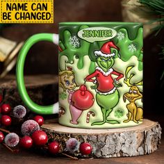 the grinch mug is next to some christmas decorations