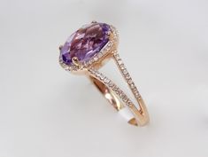 Description: BEAUTIFUL 14K ROSE GOLD LADIES DIAMONDS AND AMETHYST RING. THIS ITEM IS NEW. COMES WITH GIFT BOX. WE DO OFFER FREE SIZING. IF YOU HAVE ANY OTHER QUESTIONS PLEASE CONTACT US. ALL THE INFO ON THIS ITEM DOWN BELOW. THANK YOU VERY MUCH. KATE . Metal: SOLID 14K ROSE GOLD Stamped: 14K Total Gram Weight: 3.4GR Ring Size: 7 (RESIZEBLE) Setting: PRONG WidthTop: 12.0MM Width Bottom: 1.9MM Stones: 100% NATURAL DIAMONDS Color: F Clarity: VS1-VS2 Shape: ROUND BRILLIANT CUT DIAMONDS Total Carat W Elegant Rose Gold Oval Amethyst Ring, Elegant Oval Rose Gold Amethyst Ring, Elegant Oval Amethyst Ring In Rose Gold, Oval Amethyst Ring In Rose Gold, Pave Ring, Diamond Flower, Split Shank, February Birth Stone, Rose Gold Diamonds