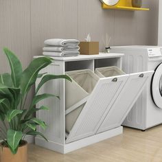 a washer and dryer sitting next to each other in a room