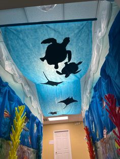 the hallway is decorated with sea creatures and under - water plastic sheeting for decoration