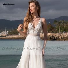 Style: BohoNeckline: V neckBack Design: BacklessTrain: Sweep TrainFabric: ulle and lace White V-neck Wedding Dress With Sweep Train, White V-neck Wedding Dress With Lace Bodice, Elegant V-neck Wedding Dress For Beach Wedding, White V-neck Wedding Dress, White Floor-length Lace Bodice Wedding Dress, White Floor-length Wedding Dress With Lace Bodice, White Wedding Dress With Sheer Bodice For Bridesmaid, V-neck Wedding Dress With Lace Bodice, V-neck Lace Bodice Wedding Dress