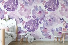 a bedroom with purple flowers painted on the wall