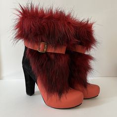 Vintage Red Pearl - MC Chunky Faux Fur High Heel Short Booties Size 38 Made in Turkey Sleek style is yours when you slip into these unique Zeyzani chunky heel boots!  This is what they mean when they say boots with the fur! So fun and so unique. Genuine Suede & Genuine Leather Upper Faux fur details upper Lined with breathe-easy genuine leather Round toe Full length zipper closure with buckle accent ¾" platform, 4" chunky heel wrapped with genuine suede Please view pictures as part of the descri Red High Heel Platform Boots For Winter, Red Heeled Boots For Winter, Red Round Toe Booties For Winter, Red High Heel Winter Booties, Red High Heel Booties For Winter, Winter Boots With Red Sole And Block Heel, Bold Winter Heeled Boots With Round Toe, Red Winter Ankle Booties, Red Ankle Booties For Winter