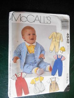 an image of a baby's outfit and bib on the cover of a sewing pattern