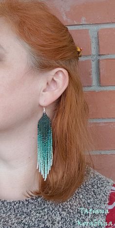 These handmade earrings are made of high-quality Czech beads and strong synthetic thread. They are elegant, fashionable, and highly versatile, suitable for everyday wear. Color: green,mint ,herbal. There may be some color discrepancies which is due to the different monitor settings 100% hand made with love! Measurements: Length-about 11.5cm (4.33 inch) Width -about 2 cm (0.79 inch) Materials: Sterling silver components Czech glass beads Strong bead weaving thread Handmade Green Chandelier Earrings For Summer, Elegant Handmade Green Tassel Earrings, Elegant Green Handmade Tassel Earrings, Green Dangle Chandelier Earrings For Summer, Summer Green Dangle Chandelier Earrings, Handmade Green Tassel Dangle Earrings, Green Handmade Tassel Dangle Earrings, Handmade Green Tassel Drop Earrings, Green Handmade Tassel Drop Earrings