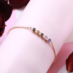 The bracelet can choose 1-12 gems, each gem can choose 12 months, each gem represents a child or a loved one. This birthstone bracelet is exquisite and elegant. It is a loving gift for mom, wife, sister or any other special lady in your life. Those who receive this bracelet can reap full of happiness and love. Mother's Day Gift Crystal Round Bracelet, Mother's Day Gift Crystal Bracelet, Mother's Day Gift Round Crystal Bracelet, Mother's Day Cubic Zirconia Bracelets, Round Gemstone Crystal Bracelet Gift, Rose Gold Gemstone Beaded Bracelet For Gift, Round Crystal Gemstone Bracelet Gift, Gemstone Crystal Bracelet As Gift, Spiritual Birthstone Jewelry For Birthday Gift