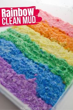 a rainbow cake with white frosting and sprinkles on top that says rainbow clean mud