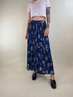 "- 90s Floral print maxi skirt  - 100% rayon - Elastic at the waist - Made in India - Tagged medium Waist: 26\" - 30\" Length: 38\" Model is 5'7, typically wears a size small and is a 26\"-27\" waist. Measurements are taken seam to seam while lying flat and are not doubled. Please refer to measurements to ensure proper fit. Due to the nature of Vintage goods there may be minor flaws or imperfections. These add to the beauty and uniqueness of each item. All sales are final. When you are ready to purchase please read our shop policies." Blue Flowy Floral Print Bottoms, Blue Rayon Maxi Skirt, Spring Rayon Maxi Skirt With Elastic Waistband, Blue Rayon Maxi Skirt For Spring, Blue Maxi-length Bottoms With Elastic Waistband, Spring Wide-leg Rayon Maxi Skirt, Blue Maxi Bottoms With Elastic Waistband, Flowy Blue Maxi Bottoms, Blue Flowy Rayon Maxi Skirt