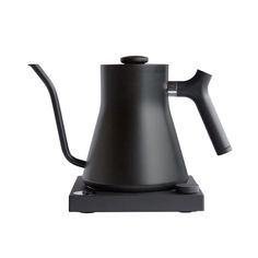 a black coffee pot sitting on top of a stove