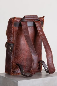 Legacy American Bison Leather Backpack with Concealed Carry Pocket | Overland Textured Leather Travel Backpack, Everyday Textured Leather Backpack, Everyday Textured Leather Standard Backpack, Luxury Backpack With Textured Leather For Daily Use, Luxury Leather Backpack With Textured Finish, Textured Leather Backpack For Everyday Use, Textured Leather Everyday Backpack, Textured Leather Standard Backpack For Everyday, Vintage Leather Satchel Backpack With Zipper