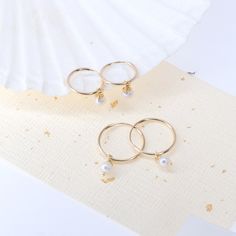 These minimalistic pearl hoop earrings are tiny endless hoops, very lightweight, but looks thick, secured with endless clasps.  ---------------♥ABOUT THE ITEM♥--------------- ★ This listing is for a PAIR of Earrings ★ The hoops made from pure 14k gold filled tube, hypoallergenic (safe for all skin types), Nickel Free! ★ Simple and dainty lovely for everyday ★ Gift for mom, sister, girlfriend, best friend ---------------♥OPTIONS TO SELECT♥--------------- ★ The HOOP measures 12 or 15 mm inner diam Real Pearl Earrings, Bridesmaid Gifts Earrings, Unisex Earrings, Earrings Hoops, Freshwater Pearl Earrings, Everyday Gifts, Freshwater Pearls Earrings, Pearl Hoop Earrings, Real Pearls