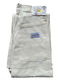 "The pride of Lebanon, N.H., Carters Jeans and Overalls motto was Watch the Wear which you'll be able to do with this deadstock pair of Carters Ecru Painters Pants.  The 100% Cotton material has been sanfordized to prevent shrinkage.  The waist snaps closed and the zipper is a Talon 42 zipper.  These products have not been used, though may have some storage wear which we have attempted to document in the photos. Marked Size: 26X32 Waist: 26\" Rise: 11.5\" Hips: 34\" Inseam: 32\" Item is for sale from Barn Owl Vintage Goods in Georgetown, Seattle's Home for Quality Vintage Deadstock Workwear! Our intent is to document every flaw but we are, alas, human and mistakes are made. All sales are final!"