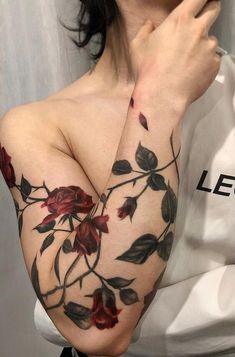 a woman's arm with flowers on it and the words gracebeth written below