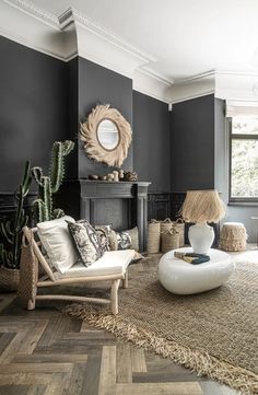 a living room filled with furniture and a fire place next to a large potted plant