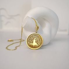 This stunning Tree of Life Buddha Necklace is a beautiful and meaningful piece that exudes peace and tranquility. The intricate design features a delicate tree of life charm with a serene Buddha at its center. Crafted with high quality materials, this necklace is perfect for adding a touch of spirituality to your everyday style. Wear it as a reminder to stay grounded and connected to nature's beauty. This unique necklace also makes a thoughtful gift for spiritual seekers and nature lovers alike. Spiritual Tree Of Life Necklace For Meditation, Faberge Jewelry, Buddha Necklace, Stay Grounded, Buddha Pendant, Elegant Pendant, Yoga Accessories, Unique Necklace, Spiritual Jewelry