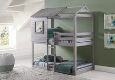 the bunk bed is made from wood and has a small house shaped roof over it