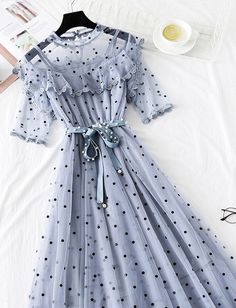 Cute polka dot short sleeve dress summer dress Fabric: tulle Color: pink,black, gray,white Size(cm): S, M, L, XL S length 106cm bust 90cm sleeve length 24cm M length 107cm bust 94cm sleeve length 25cm L length 108cm bust 98cm sleeve length 26cm XL length 109cm bust 102cm sleeve length 27cm Polka Dot A-line Mini Dress For Summer, Summer Ruffle Dress With Half Sleeves, Polka Dot Mini Dress For Summer, Polka Dot Summer Dress With Short Sleeves, Gray Summer Party Dress, Spring Knee-length Swiss Dot Dress, Elegant Short Sleeve Swiss Dot Dress, Summer A-line Polka Dot Mini Dress, Gray Short Sleeve Midi Dress For Summer