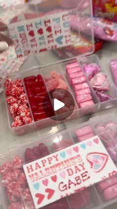 valentine's day candy in plastic containers on a table