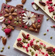 three pieces of chocolate with nuts, raspberries and pistachio