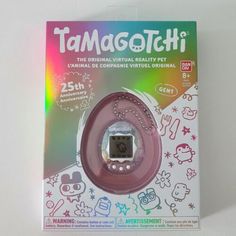 the packaging for tamagotchi is displayed on a white surface with an image of cats