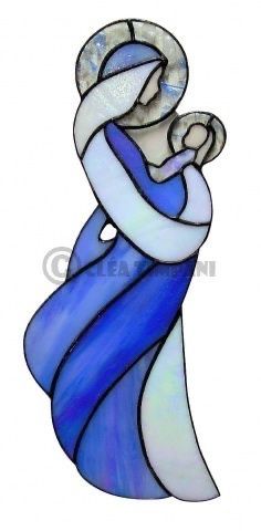 a blue and white stained glass window with a woman holding a baby in her arms