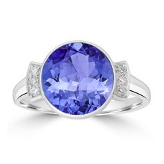 10mm Violetish Blue Tanzanite AAAA Ring Round shape 5ct with 0.08cttw Diamond in 14K & 18K White Gold, Yellow Gold & Rose Gold. Product Information SKU TT35845 Metal Type Your choice: 14K, 18K Metal Color Your choice: White Gold, Yellow Gold, Rose Gold Metal Weight 3.9 Primary Stone Gemstone Name Tanzanite Gemstone Species Zoisite No. Of Gemstones 1 Gemstone Shape Round Gemstone Color Violetish Blue Gemstone Grade Your choice: AA Gemstone Clarity VVS Gemstone Total Carat Weight 5 cttw Gemstone S Tanzanite Rings With Diamond Accents In Round Cut, Tanzanite Rings With Diamond Accents Round Cut, Tanzanite Diamond Ring With Diamond Accents, Round Tanzanite Diamond Ring With Accent Stones, Tanzanite Diamond Ring With Accents, Round Tanzanite Diamond Ring For Anniversary, Modern Tanzanite Round Rings, Classic Round Tanzanite Birthstone Ring, Tanzanite Diamond Ring With Center Stone