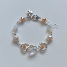 Pearl Bracelet With Charm, Cute Pearl Charm Jewelry, Orange Beads Bracelet, Handmade Cute Pearl Bracelet, White Beaded Pearl Charm Bracelet, Elegant Pearl Beaded Charm Bracelet, Glass Beads Jewelry, Bracelets Design, Beads Bracelet Design