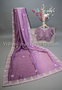 This dark mauve saree and blouse set is elegantly embroidered with stones and crystals, adding a touch of glamour to your look. Made from soft and easy to drape organza fabric, it offers comfort and effortless style. Perfect for special occasions and wedding events. Elegant Purple Chanderi Pre-draped Saree, Purple Chinon Saree Blouse Piece, Purple Embroidered Georgette Fabric Saree, Purple Semi-stitched Chinon Blouse Piece, Purple Embroidered Georgette Blouse Piece, Embroidered Purple Georgette Blouse Piece, Purple Embroidered Georgette Pre-draped Saree, Elegant Purple Georgette Embroidered Fabric, Elegant Purple Embroidered Georgette Fabric