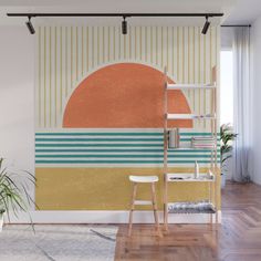 an orange and blue wall mural in a living room with a ladder to the right