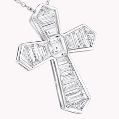 A contemporary interpretation of a classic motif, this Cross pendant in 18 carat white gold is beautifully crafted to showcase the sleek beauty of baguette cut diamonds. Custom cut to fit the design, the diamonds are individually handset by our master artisans to taper in size as they radiate outwards. An elegant Classic Graff cross motif baguette cut diamond pendant with a total weight of approximately 3.06 carats. Diamond White Platinum Necklace With Baguette Diamonds, Platinum Diamond Necklace With Baguette Diamonds, Platinum Diamond White Necklace With Baguette Diamonds, Luxury White Gold Diamond Necklace With Baguette Diamonds, White Baguette Cut Diamond Necklace, Luxury Silver Baguette Cut Diamond Necklace, Luxury Silver Baguette-cut Diamond Necklace, White Gold Diamond Necklace With Baguette Diamonds In Platinum, Luxury Silver Emerald Cut Diamond Necklace