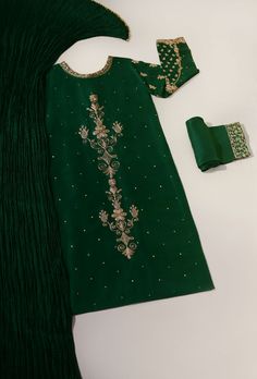 Adorned on pure raw silk 58 Gms, in a deep emerald green hue intricately hand embellished with dabka, zari, naqshi and sequins. The length of the long kameez is 46 inches. Accompanied with matching trousers and pure silk crushed dupatta featuring handmade buttons. An alluring three piece with old world charm, perfect f Long Kameez, Deep Emerald Green, Handmade Buttons, Old World Charm, Raw Silk, Three Piece, Pure Silk, Old World, Festival Season