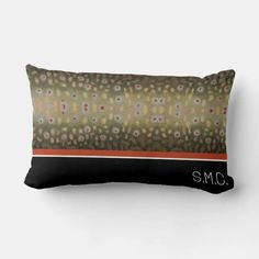 a brown and black pillow with the word smc printed on it's side